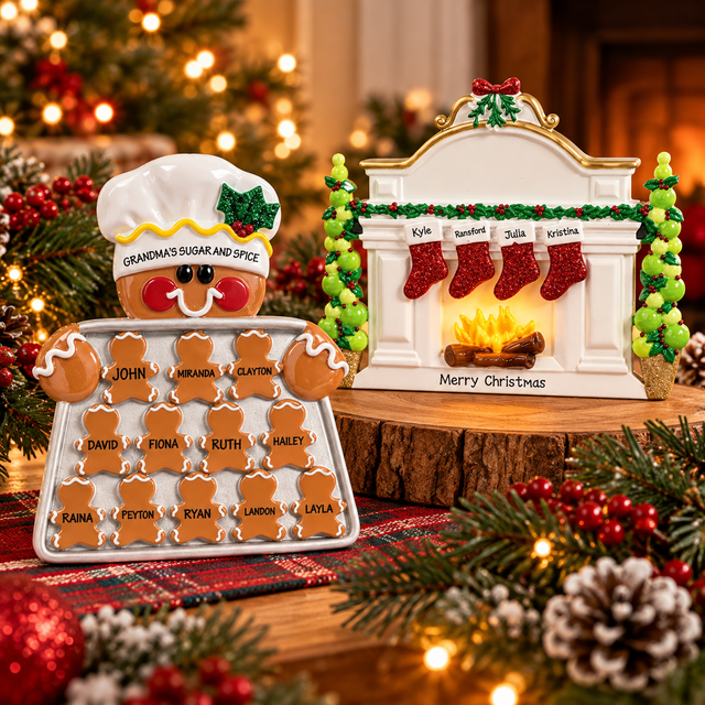 Personalized Christmas table toppers featuring a gingerbread family cookie display and a festive fireplace with four stockings, surrounded by evergreen greenery and warm Christmas lights.