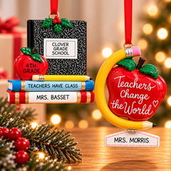 Personalized teacher Christmas ornaments featuring a school notebook with books and an apple, alongside a red Teachers Change the World ornament, displayed against a warm, festive holiday background.
