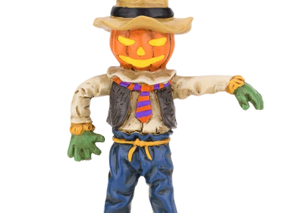 Pumpkin head scarecrow Halloween ornament featuring a jack-o'-lantern face, rustic hat, striped orange and purple tie, blue pants, and green gloves.