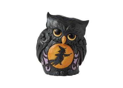 Black Halloween owl figurine with golden eyes, purple accents, and an orange moon featuring a witch flying on a broomstick.