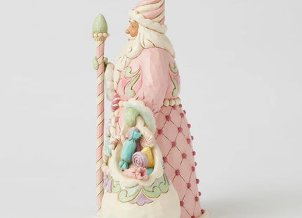 Jim Shore pink Candy Cane Santa Christmas ornament featuring pastel peppermint candies, candy cane trim, folk-art details, and a coordinating sack of sweets.