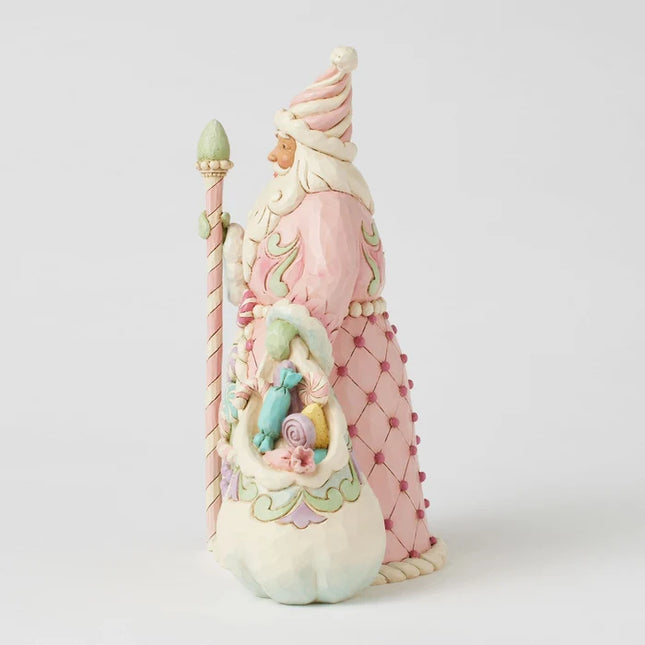 Jim Shore pink Candy Cane Santa Christmas ornament featuring pastel peppermint candies, candy cane trim, folk-art details, and a coordinating sack of sweets.
