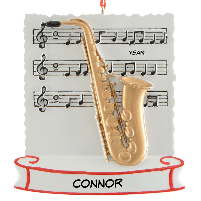Personalized saxophone Christmas ornament with name and year featuring a gold saxophone and sheet music background.
