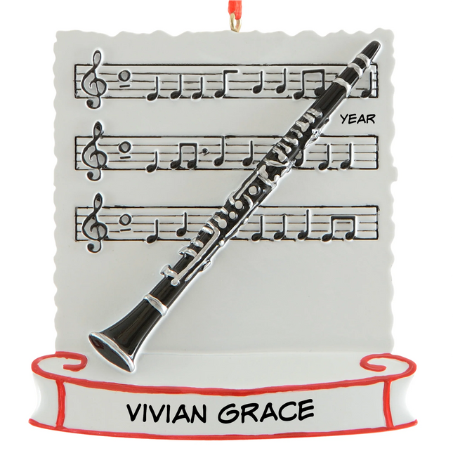 Personalized clarinet Christmas ornament with name and year featuring a black and silver clarinet on sheet music.
