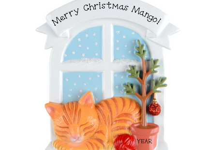 Personalized orange tabby cat Christmas ornament by a snowy window with custom name and year.