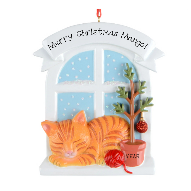 Personalized orange tabby cat Christmas ornament by a snowy window with custom name and year.
