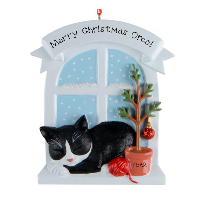 Personalized tuxedo cat Christmas ornament by a snowy window with custom name and year.