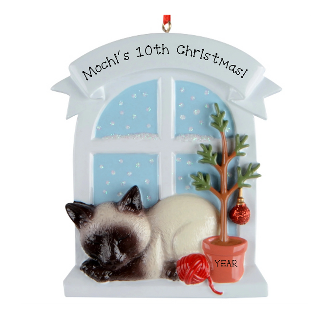 Personalized Siamese cat Christmas milestone ornament by a snowy window with custom name, Christmas number and year.