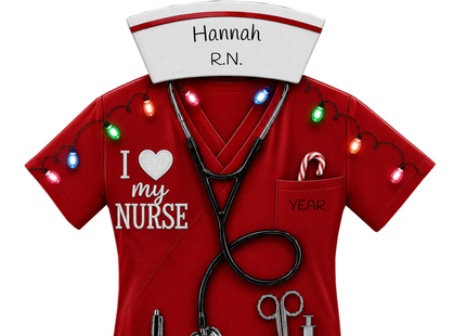 Personalized nurse Christmas ornament with red scrubs, stethoscope, medical tools, custom name, nursing title and year.