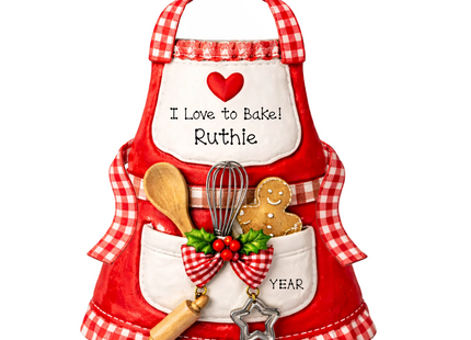 Personalized baker Christmas ornament with red apron, baking utensils, gingerbread cookie, custom name and year.