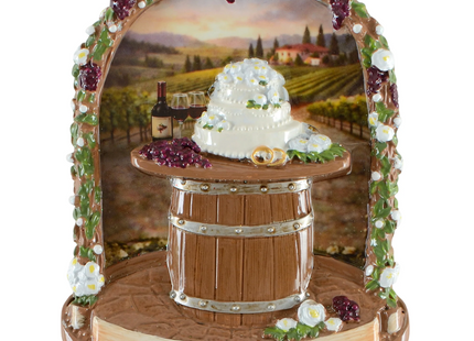 Personalized vineyard wedding Christmas ornament with wedding cake, wine barrel, grapes, custom couple name and wedding date.