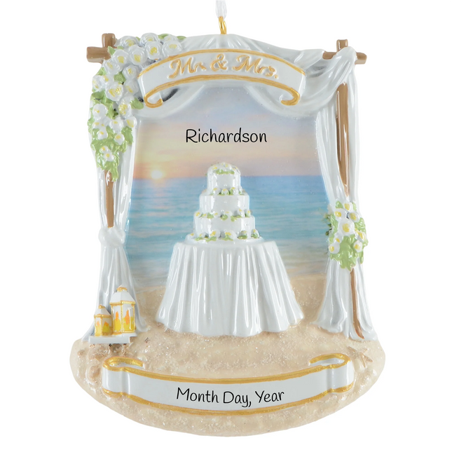 Personalized beach wedding Christmas ornament with ocean backdrop, wedding cake, custom couple name and wedding date.
