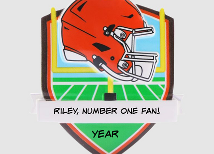 Personalized Cleveland Browns football helmet Christmas ornament with custom name and optional year on a football field background.