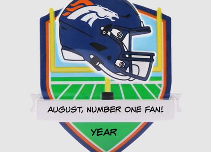Personalized Denver Broncos football helmet Christmas ornament with custom name and optional year on a football field background.