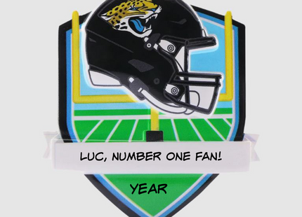 Personalized Jacksonville Jaguars football helmet Christmas ornament with custom name and optional year on a football field background.