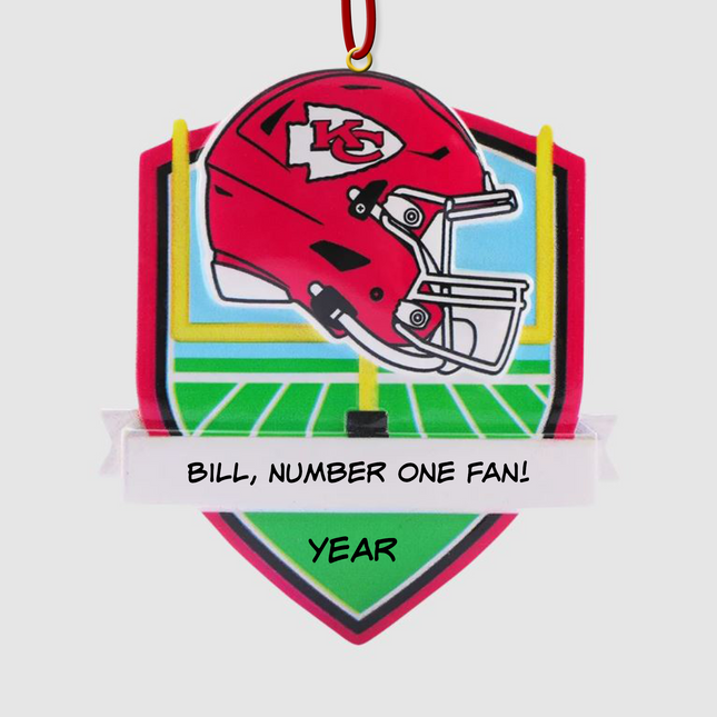 Personalized Kansas City Chiefs football helmet Christmas ornament with custom name and optional year on a football field background.