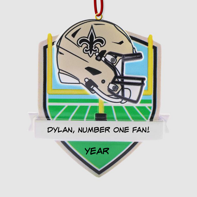 Personalized New Orleans Saints football helmet Christmas ornament with custom name and optional year on a football field background.