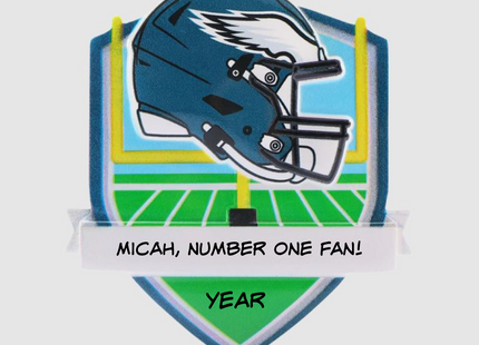 Personalized Philadelphia Eagles helmet Christmas ornament featuring a football field background and custom name banner.