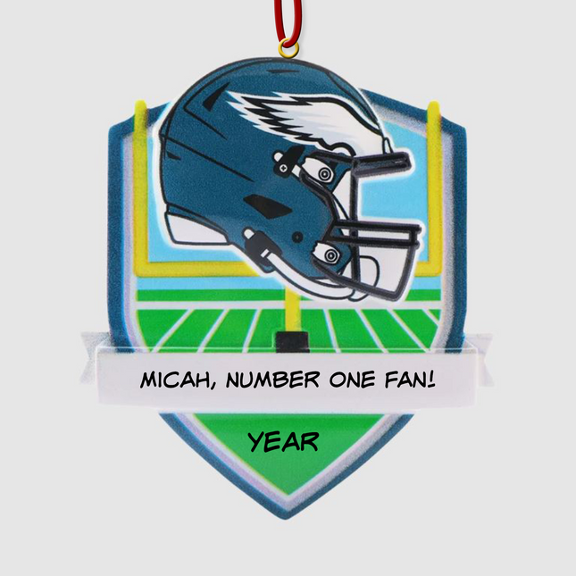 Personalized Philadelphia Eagles helmet Christmas ornament featuring a football field background and custom name banner.