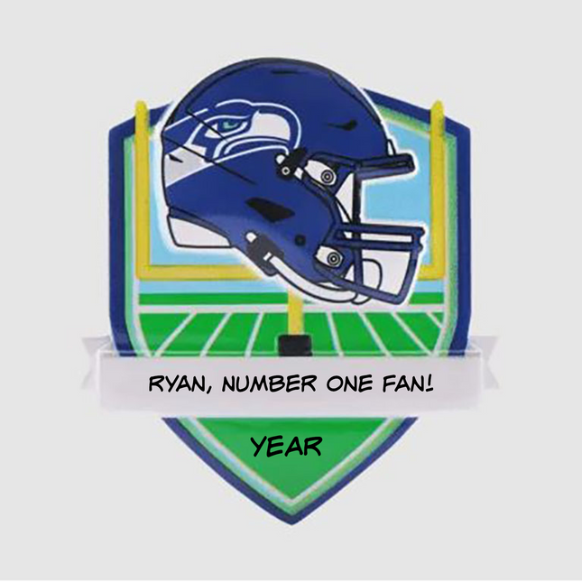Personalized Seattle Seahawks helmet Christmas ornament featuring a football field background and custom name banner.
