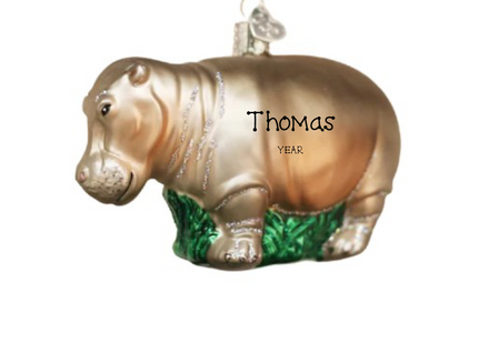 Personalized hippopotamus Christmas ornament with custom name and year on the side.