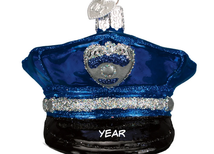 Personalized blue police officer hat glass Christmas ornament with silver badge and custom year.