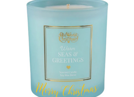 Personalized Warm Seas & Greetings scented soy candle in a frosted aqua glass jar with a custom holiday message on the front.