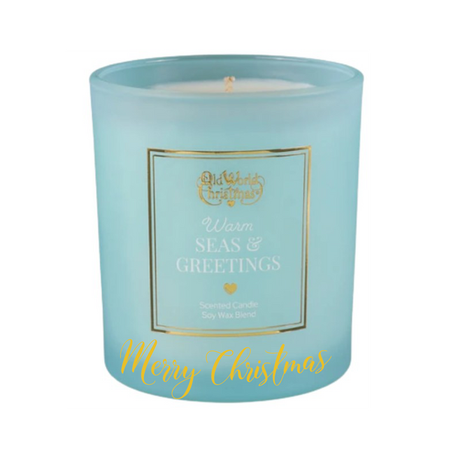 Personalized Warm Seas & Greetings scented soy candle in a frosted aqua glass jar with a custom holiday message on the front.