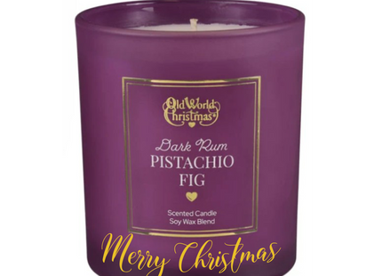 Personalized Dark Rum Pistachio Fig scented soy candle in a plum glass jar with a custom holiday message on the front.