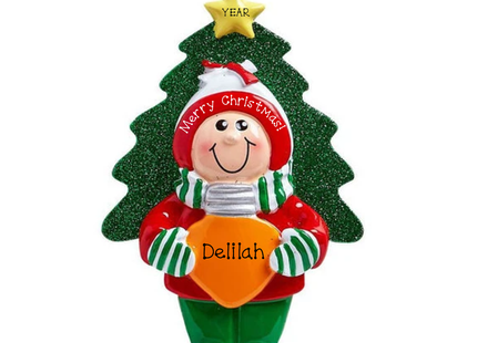Personalized kids Christmas ornament featuring a child in festive winter clothing, glittery Christmas tree, orange name plaque and yellow star