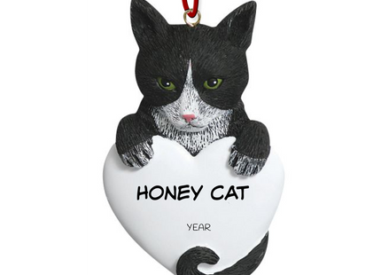 Personalized black and white tuxedo cat heart Christmas ornament with custom cat name and year featuring a tuxedo cat peeking over a white heart.