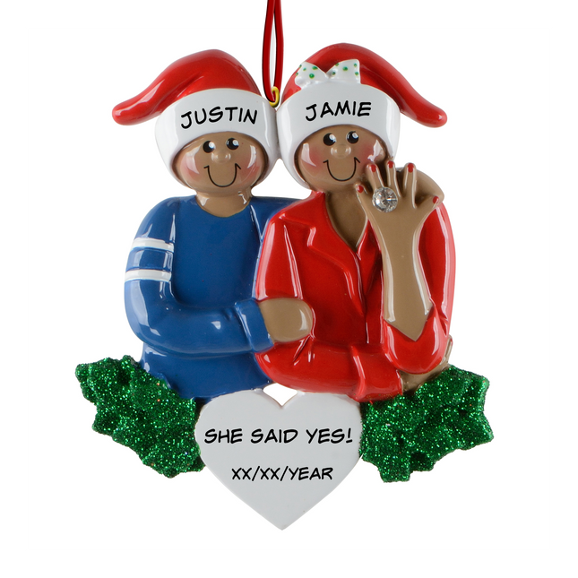 Personalized African American She Said Yes engagement Christmas ornament with two names and engagement date featuring a couple in Santa hats and an engagement ring.