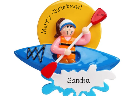 Personalized female kayaking ornament with blue kayak, pink shirt, Sandra on water splash and year on red paddle