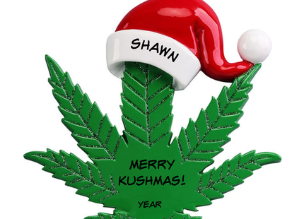Personalized green cannabis leaf Christmas ornament wearing red Santa hat with Shawn, Merry Kushmas and year lettering