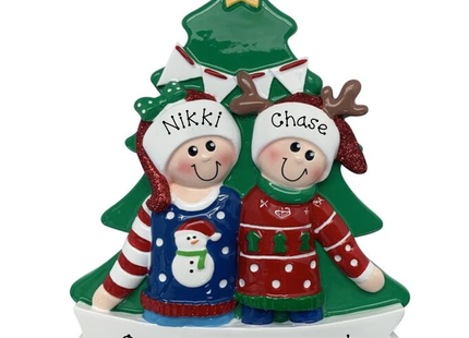 Personalized couple Christmas tree ornament featuring two people wearing festive holiday sweaters with custom names, message, and year.