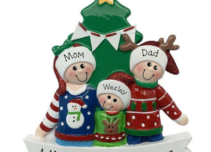Personalized family of 3 Christmas tree ornament featuring parents and child in festive sweaters with custom names, holiday message, and year.