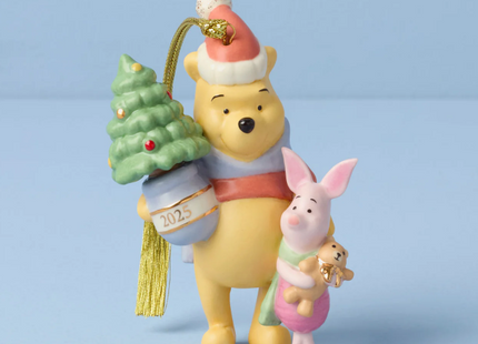Christmas ornament featuring Winnie the Pooh and Piglet with a small tree on a blue background
