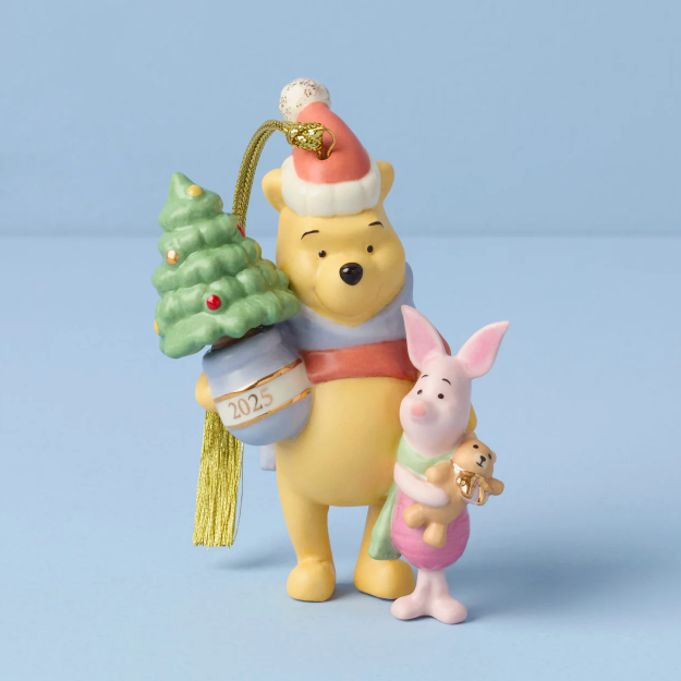 Christmas ornament featuring Winnie the Pooh and Piglet with a small tree on a blue background
