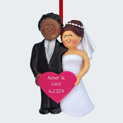 Bride and Groom Holding A Pink Heart Personalized Ornament - GENDER & HAIR COLOR - Male Brown /Female Blonde created by ORNAMENT SHOP EXCLUSIVE and designed by Ornament Shop