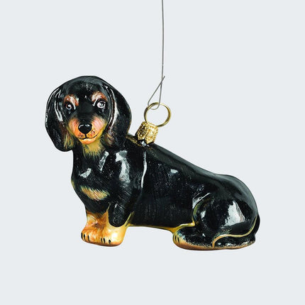 Dachshund Sitting Black Glass Christmas Ornament created by JOY TO THE WORLD and designed by Ornament Shop
