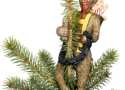 Krampus Christmas tree topper featuring a horned folklore figure with a long red tongue, black chain, branches, and child on his back.