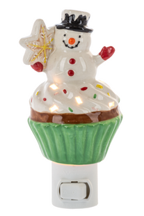 Christmas snowman cupcake night light featuring a smiling snowman with a black top hat, decorative star, colorful sprinkles, and green cupcake wrapper.