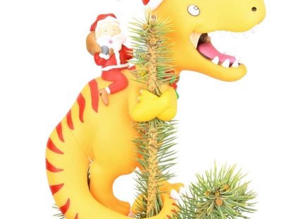 Santa riding a yellow dinosaur Christmas tree topper featuring a toothy dinosaur wearing a red Santa hat.