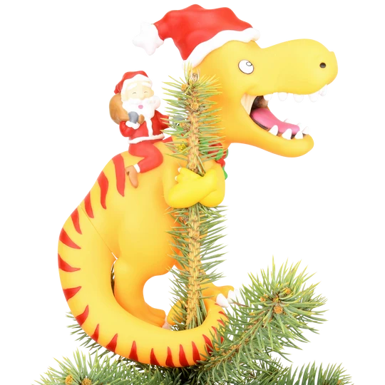 Santa riding a yellow dinosaur Christmas tree topper featuring a toothy dinosaur wearing a red Santa hat.